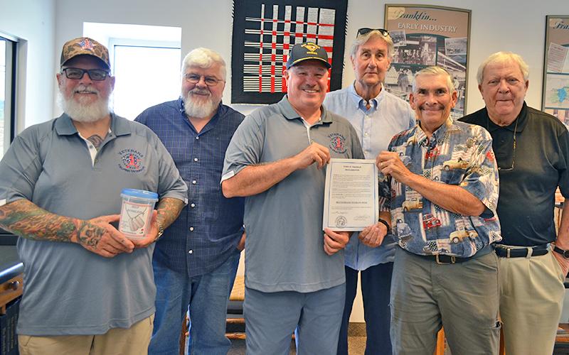 Press photo/Mia Overton. The First Presbyterian Church Men’s Group and 828 Vets are teaming up again for the annual Help Homeless Veterans Week. Donation buckets will be placed at 55 businesses around town. (Front, from left) Dave Porter and Bill Garren of 828 Vets and Ned Kraft of the Presbyterian Men’s Group along with Men’s Group members (back row) Carl Winter, Jeff Stevens and Tom Fagg. Franklin Mayor Jack Horton presented a proclamation on Aug. 4 designating Sept. 7-13 as Help Homeless Veterans Week.