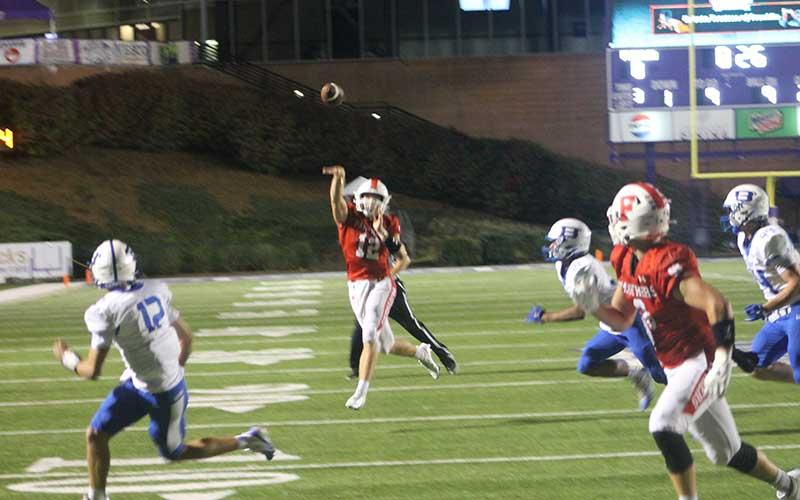 Press photo/Will Woolever - Junior quarterback Anderson Terrell throws a touchdown to Brock Bradley (right) against Brevard at WCU Sept. 18.