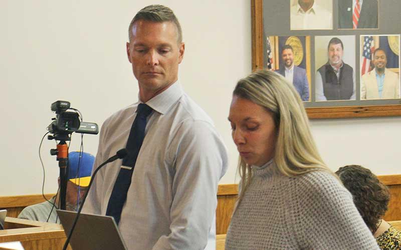 Press photo/Shelby Powell - Superintendent Josh Lynch and Macon County Schools Finance Officer Alayna Ledford speak to commissioners about the school’s budget shortfall.