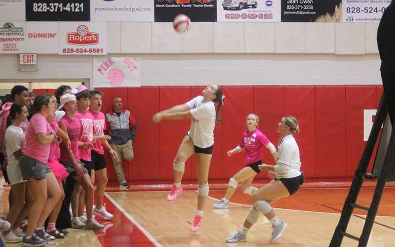 Press photo/Will Woolever - Franklin’s student section backs away as junior Sadie Green keeps a ball in play versus North Henderson Sept. 30.