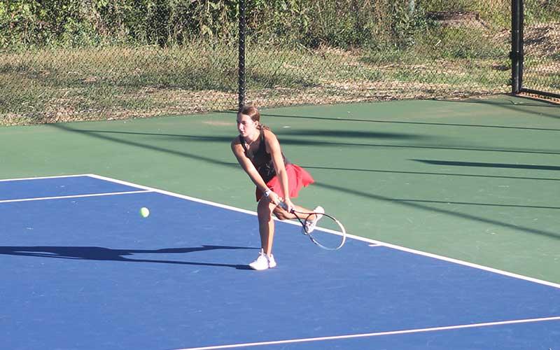 Press photo/Will Woolever - Sophomore Elise Phillips prepares to hit a difficult groundstroke versus West Henderson Oct. 1.