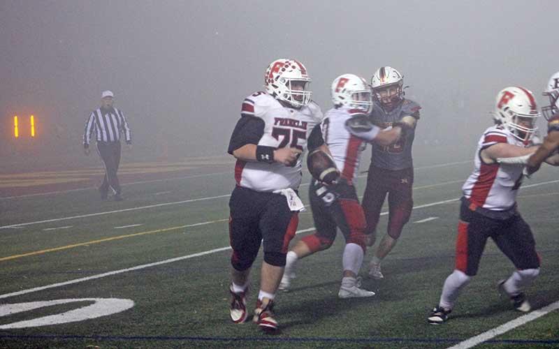 Press photo/Will Woolever - Senior captain center/nose guard Mace Waldroop returns a kickoff in Franklin’s third-round state playoff game at Hickory Nov. 21.