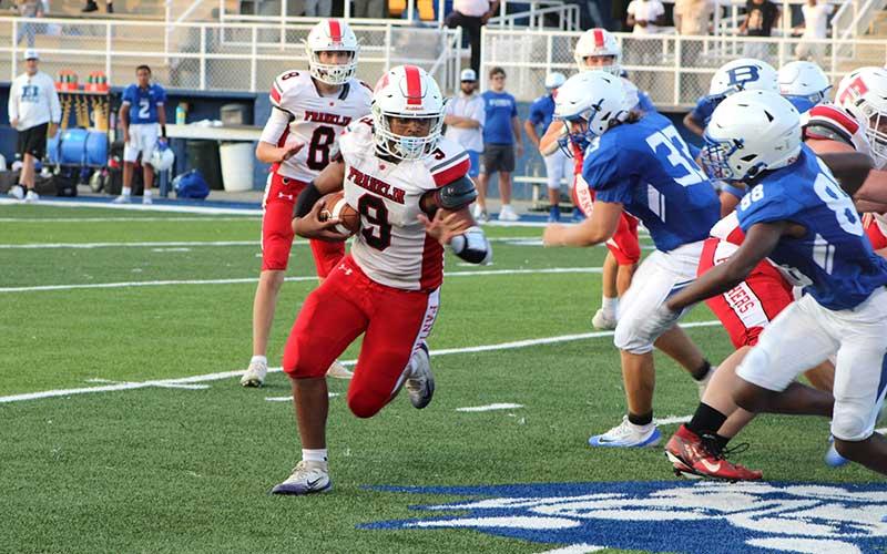 Photo submitted - Freshman Antonio Hernandez carries the ball in Franklin’s hard-fought 14-6 win at Brevard Sept. 17.