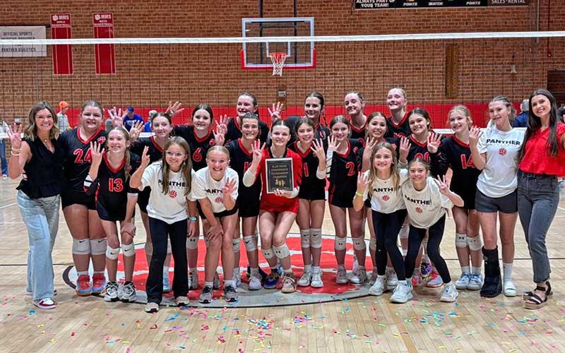 Photo submitted - Macon Middle School volleyball shows off their fourth-straight championship plaque after defeating Smoky Mountain in the Blue Ridge Athletic Conference Final.