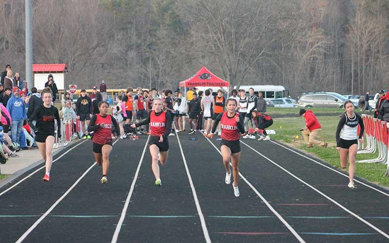 Press photo/Will Woolever - Kai Pelletier (left), Anna Timan and Michelle Ortega run a close race in the girls 55-meter dash at Macon Middle School Dec. 3.