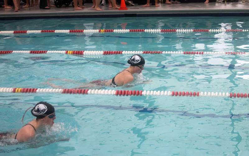 Press photo/Will Woolever - Franklin High School’s Lana Walker (left) and Kenna Keyworth swim a close race in the girls 100-yard breaststroke at Franklin Health and Fitness Dec. 6. 