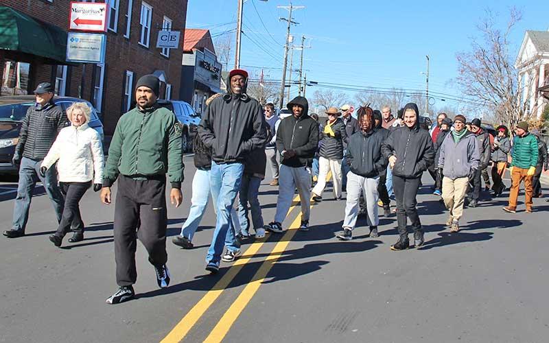 Press photo/Shelby Powell - Dozens of locals bundled up to celebrate MLK Day on Sunday, meeting first at the gazebo downtown and marching up Main Street to Franklin First United Methodist Church to remember Dr. Martin Luther King Jr., to celebrate his accomplishments in life and to acknowledge where his work has not yet been completed.