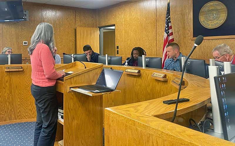 Press photo/Shelby Powell - Macon County librarian Abby Hardison answers questions about Jackson County proposals to change the FRL Interlocal Agreement during the Jan. 13 Board of Commissioners meeting.