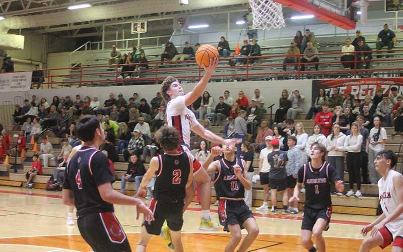 Press photo/Will Woolever - Junior Will Rauers elevates to the rim versus Andrews Jan. 5.