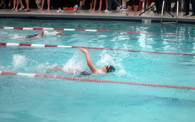 Press photo/Will Woolever - Eleanor Kessler competes for Macon Early College in the 100-yard backstroke at Franklin Health and Fitness Dec. 10.