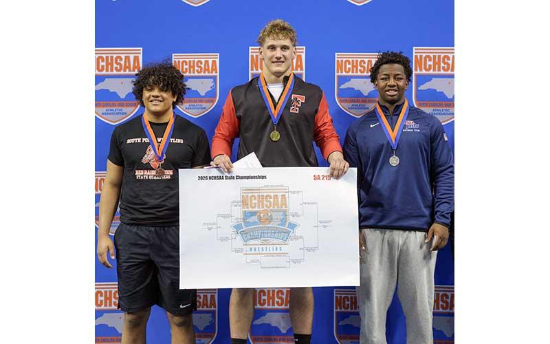 Photo courtesy of Josh Young - Young shows off his gold medal in the 215-lb. weight class at the 5A State Championships Feb. 20.