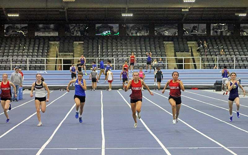 Press photo/Will Woolever - Anna Timan (left) and Michelle Ortega compete in the 55-meter dash at the Mountain Eight Conference Championships Jan. 29.