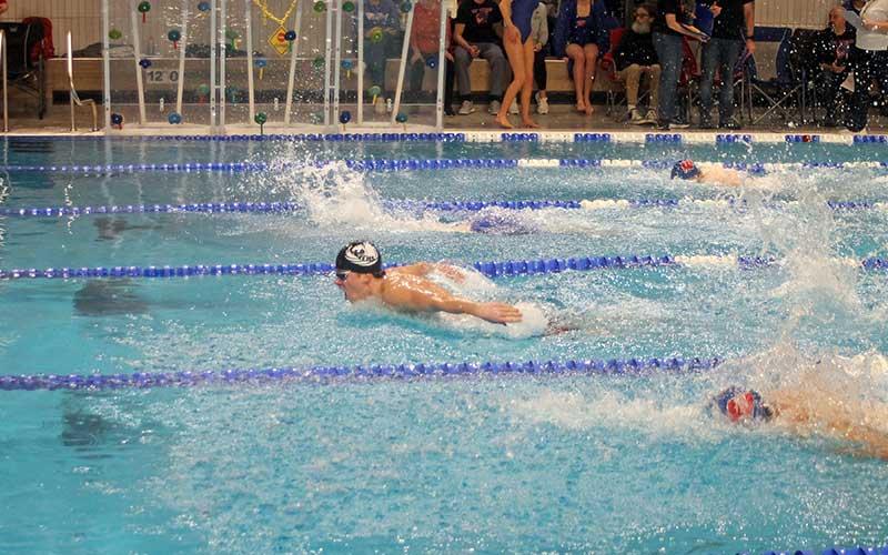 Press file photo - Thatcher Daniels swims the 200-yard individual medley in the Mountain Eight Conference Championships at the Jackson County Aquatic Center in Cullowhee Jan. 20.