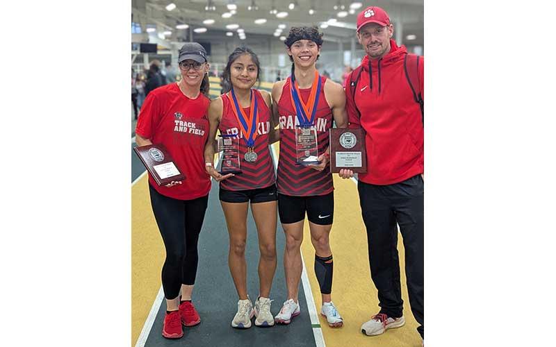 Photo courtesy of Melissa Ward - Amy Mendoza Lopez and Reid Laseter show off their Sportsmanship Awards at the 5A state meet in Winston-Salem Feb. 18, along with Panther head coaches Melissa Ward and Matt Harlfinger.