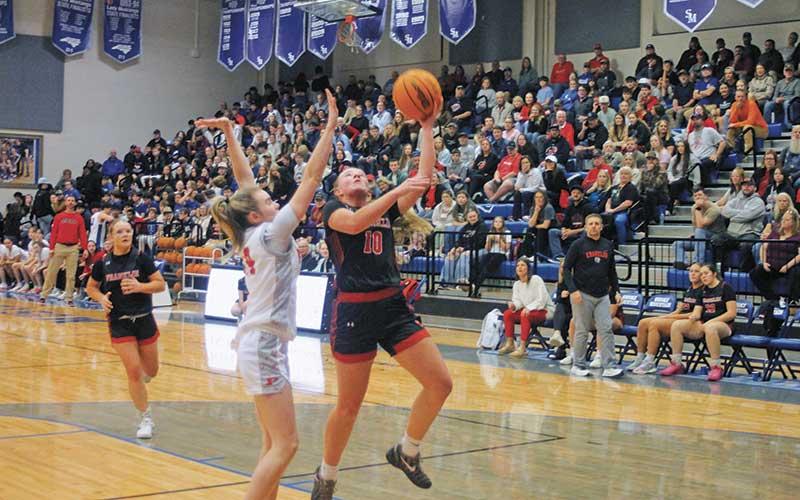 Bristol Brooks attempts a contested shot in the Mountain Eight Conference Final versus Pisgah Feb. 19. (Press photo/Will Woolever)