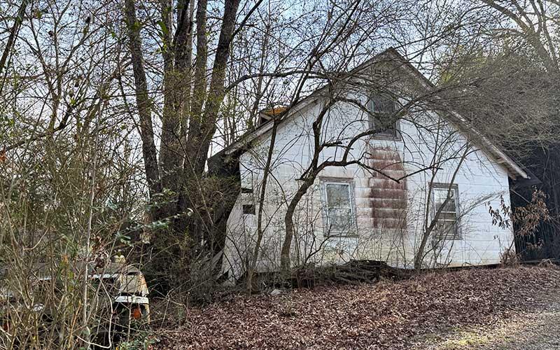 Press photo/Mia Overton - Part of the house at 574 Womack Street has collapsed. After giving the owner a 90-day notice last May to demolish the house, the Town Council voted on March 2 to declare it dilapidated and have it torn down.