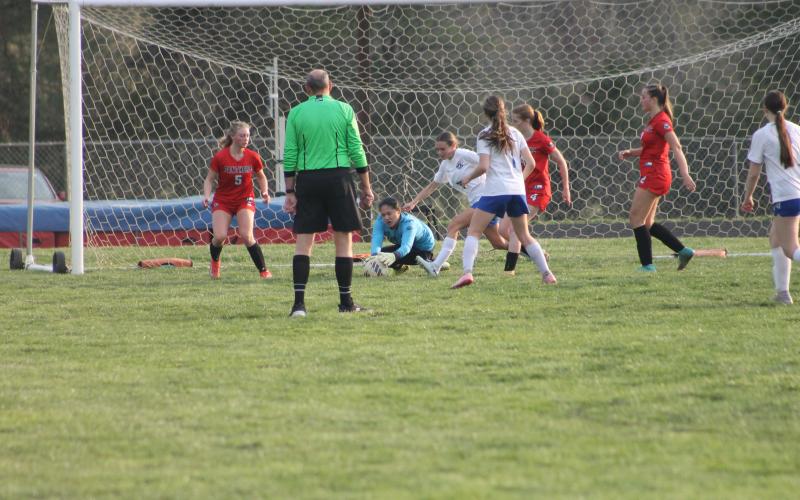 Press photo/Will Woolever. Goalkeeper Carramia Ramos corrals a loose ball versus Polk at Macon Middle School March 20. The senior captain has held Franklin’s opponents to one goal combined, helping earn three wins and a tie.