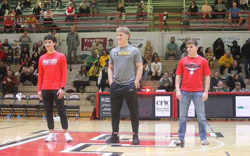 Press photo/Will Woolever - Franklin’s winter sports state champions are recognized at center-court during a Panther hoops home playoff game Feb. 26. From left are Ken Modlin (track and field), Garrett Young (wrestling) and Jonah Brant (diving).