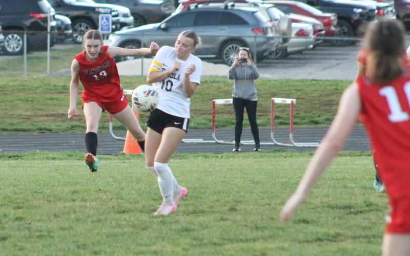 Press photo/Will Woolever. Junior captain/center back Sadie Collins clears a ball from danger versus Tuscola April 1.