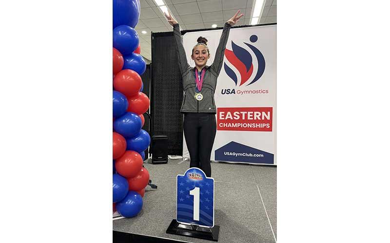 New Vision gymnast Giovanna Williams shows off her vault gold medal at the USA Gymnastics Level 9 Eastern Championships in Savannah, Georgia, earlier this month. (Photo submitted)