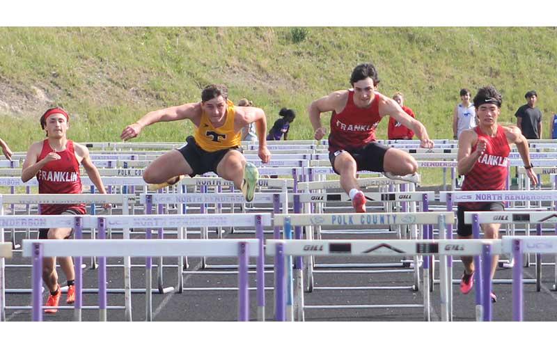 From left, Chad Engel, a Tuscola Mountaineer, Jonas Phillips and Ken Modlin compete in the 110-meter hurdles at the Mountain Eight Conference Championships at North Henderson April 30. (Press photo/Will Woolever)
