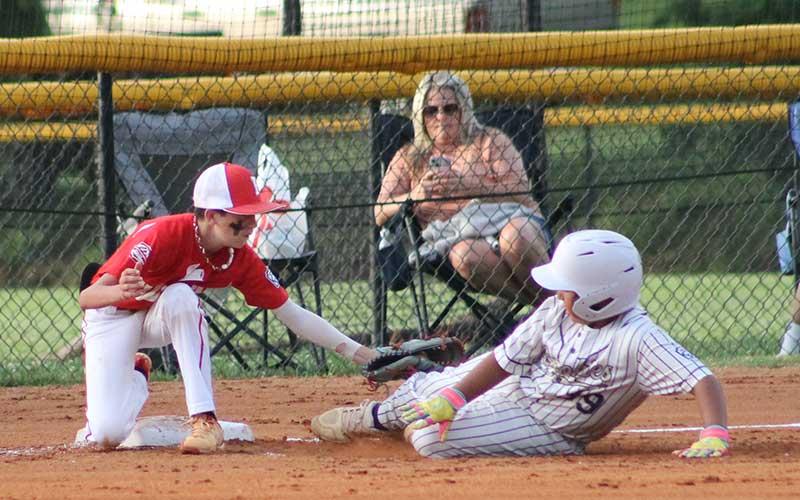 Sawyer Dills tags out a runner at third base for the Franklin Minor League Baseball All-Stars' versus Great Smokies.(Press photos/Will Woolever)