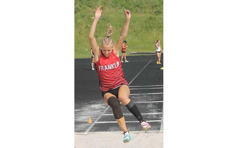 Kamden Reis competes in the long jump at the Mountain Eight Conference Championships at North Henderson April 30. The junior was named the meet’s Women’s Field Event MVP, placing first in the long jump, first in the triple jump and second in the high jump. (Press photo/Will Woolever)