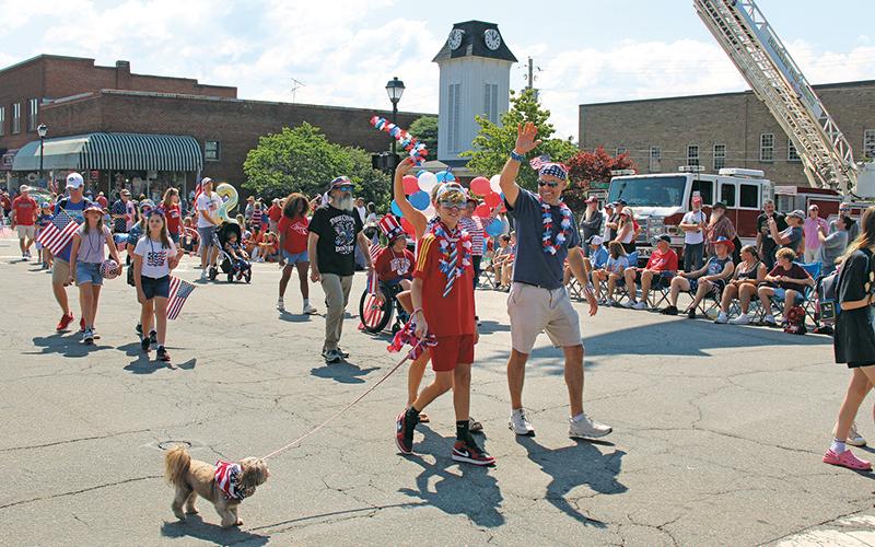 Press file photo - All are welcome to join in the July 4 parade. Put on your most patriotic outfit and meet at Town Hall at 10:30 a.m. The parade begins at 11 a.m. followed by the Little Mr. and Miss Firecracker contest and the patriotic pet contest.