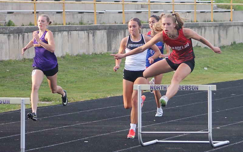 Anna Timan runs the 300-meter hurdles at the Mountain Eight Conference Championships April 30. Credit: Press file photo
