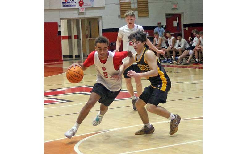 Junior Cailen Chavis drives into the lane versus Highlands. (Press photo/Will Woolever)