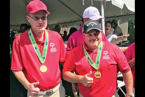 Golf partners Jason Hedrick and Eric Hall.