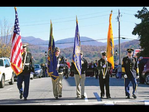 Press photo/Linda Mathias - Veterans march up Main Street during Monday’s Veterans Day Parade.