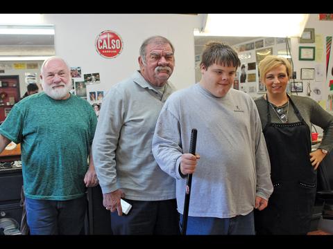 Press photo/Jake Browning - Ethan Hitchcock has been a valued member of the Modern Barber Shop team for two months now. From left: Fred McCaskey, Bob Bobber, Ethan Hitchcock and Courtney Blackburn. 