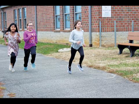 Press Photo/Jake Browning Ashley Mendoza, Ilyssa Ezechel and Channing Ray are shown during a practice run.