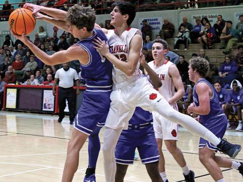 Press photo/Andy Scheidler Franklin’s Griffin Green gets called for a foul on this play. The sophomore made far more positive plays, however, including sinking six 3-pointers in the Panthers’ win Friday against Brevard. It was a career-high for the first-year varsity player. 
