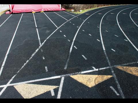 Press photo/Andy Scheidler - Large areas of the Franklin High School track have been repaired where bubbles formed because of poor drainage. However, repairs are no longer adequate to where FHS can host other teams to compete. 