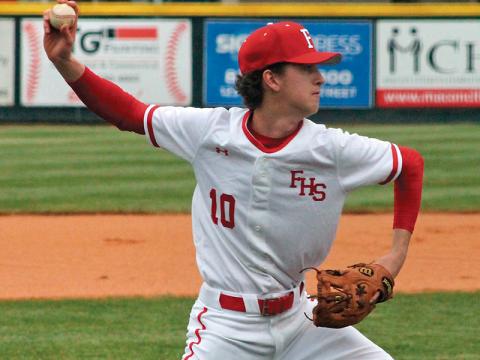 Press photo/Andy Scheidler Tanner Carlton throws to first after fielding a grounder in front of the mound during a Franklin home game last week. FHS went 3-0 before the NCHSAA ban on athletic contests. 