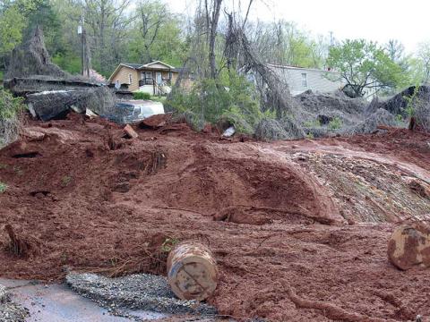 Press photo/Jake Browning - This mudslide near Chavez Road was one of eight caused by the estimated 5 inches of rain that swamped the county.