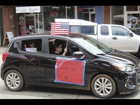 Press photo/Jake Browning - Several carloads of people rallied on Main Street in Franklin on Friday, April 24, calling for lifting coronavirus restrictions.