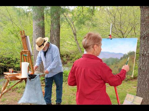 Press photo/Jake Browning - Jon Houglum and Sally Mass paint along Cartoogechaye Creek at Parker Meadows.