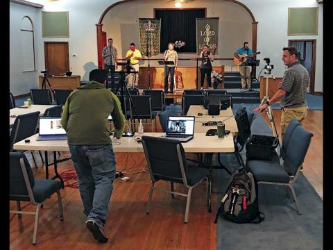 Photo submitted - Daniel Rogers (left) and Lee Cloer work the computers during a live-streamed service at Holly Springs Baptist Church. 