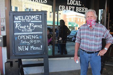 Press photo/Jake Browning - Root and Barrel owner Gary Murphy stands ready with a thermometer to check diners on Saturday, May 23.
