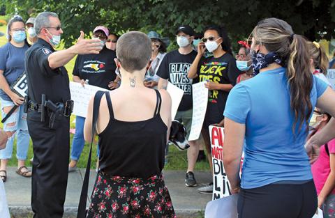 Press photo/Jake Browning - Franklin Police Chief Bill Harrell talks with protestors before the second Black Lives Matter rally in Franklin.