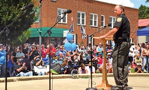 Press photo/Linda Mathias - Macon County Sheriff Robert Holland addresses the crowd that packed town square for the Back the Blue event.
