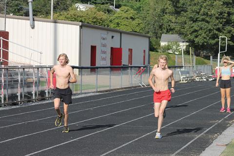 Press photo/Will Woolever - FHS seniors Ethan and Nathan Stamey run during a recent cross country practice.