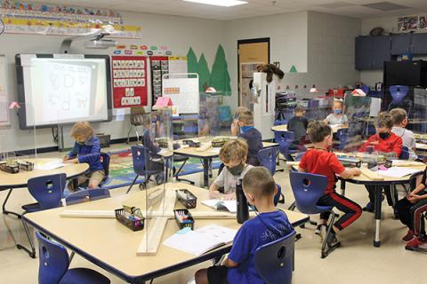 Press photo/Jake Browning Sheena Hughes’ kindergarteners at Iotla Valley Elementary School are in school for four days per week for the first time this year and are learning a lot from face-to-face instruction, albeit from behind plexiglass.