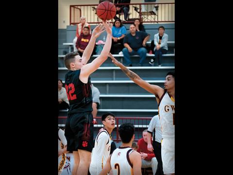 File photo - Franklin junior forward Miles McClure releases a shot during a game last season. McClure returns after leading the team in scoring and earning All-Mountain Six Conference honors. 
