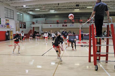 Press Photo/Will Woolever - Senior setter Rylee Corbin saves a ball in a match against East Henderson on Dec. 15. 
