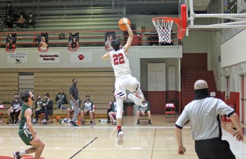 Press Photo/Will Woolever - Junior guard Griffin Green goes up for a dunk in a game against East Henderson Feb. 5. The Panthers will look to secure a berth in the Mountain Six tournament after moving to 4-3 on the season.