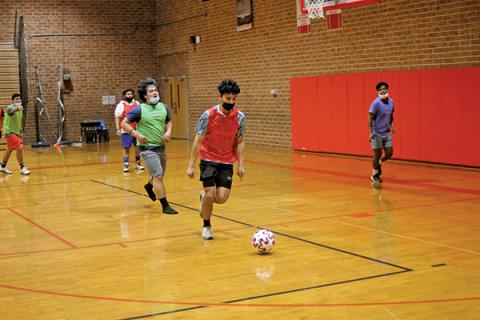 Press Photo/Will Woolever - Junior striker Luis Torres lines up a shot in a recent practice while goalkeeper Isaac Jennings (left) and defender/midfielder Flady Mendoza (background) look on. Torres recorded a rare ‘hat trick’, or three goals in a single game, against Brevard Feb. 11.